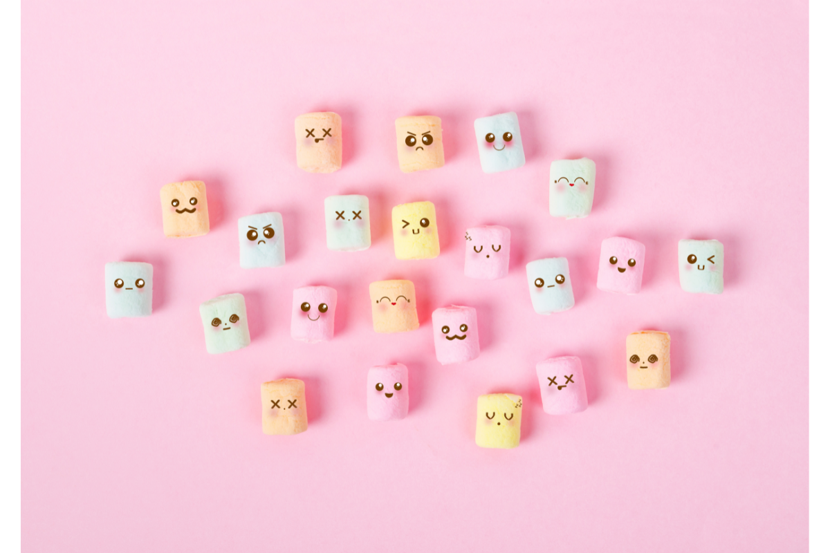 Des pastilles colorées avec des expressions faciales variées sont dispersées sur un fond rose, symbolisant le large spectre des émotions humaines. Chaque pastille représente une émotion différente, allant de la joie à la tristesse, en passant par l'anxiété et la sérénité, évoquant ainsi la gamme des élixirs floraux de Biofloral conçus pour aider à harmoniser ces états émotionnels. Contrôler ses émotions avec Biofloral