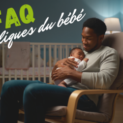 Père qui berce son bébé souffrant de coliques dans une chambre calme – colique bébé que faire, gestes apaisants et solutions naturelles.